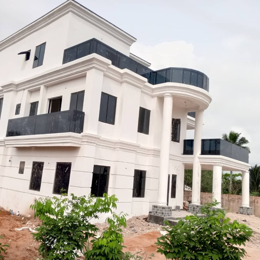 Completed three-storey white residence